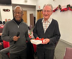 Fr. Oliver Iwuchukwu, CSSp (Provincial Superior) presents appreciation award to Fr. Barney Kelly , CSSP at the annual Spiritan Advent dinner, December 11, 2023
