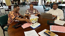 Spiritan confreres comparing notes in between Chapter sessions